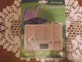 připominkovač léku-nikdy nepoužitý.